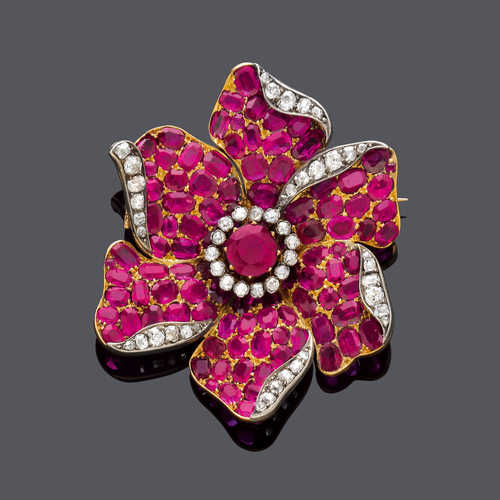 RUBY AND DIAMOND FLOWER BROOCH, ca. 1920. Silver and yellow gold.