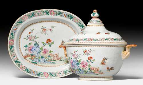 A LARGE FAMILLE ROSE TUREEN AND COVER ON STAND.
