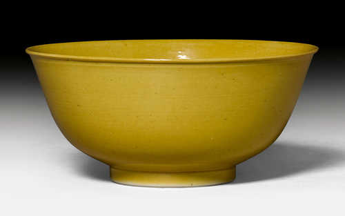 A YELLOW GLAZED BOWL.