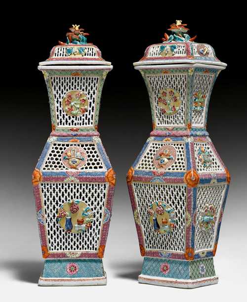 A PAIR OF FAMILLE ROSE OPENWORK VASES AND COVERS.