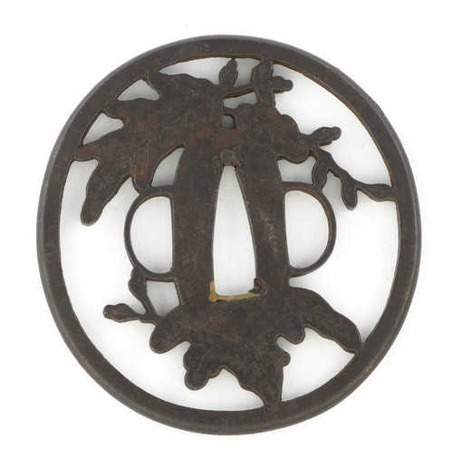 AN IRON SUKASHI-TSUBA ATTRIBUTED TO THE NISHIGAKI SCHOOL.