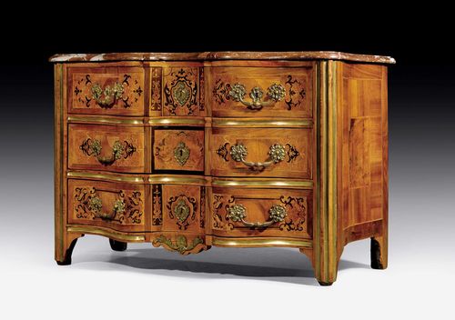 COMMODE "EN ARBALETE",Regence, probably Grenoble circa 1730. Walnut, birch and local fruitwoods in veneer with fine inlays. The front with 3 drawers, the top drawer divided into 3. Gilt bronze mounts and drop handles. "Griotte Rouge" top. 130x63x82 cm.