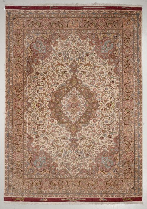 TABRIZ old.White central field with a green and white central medallion, the entire carpet is finely patterned with trailing flowers and palmettes, beige edging, 250x350.