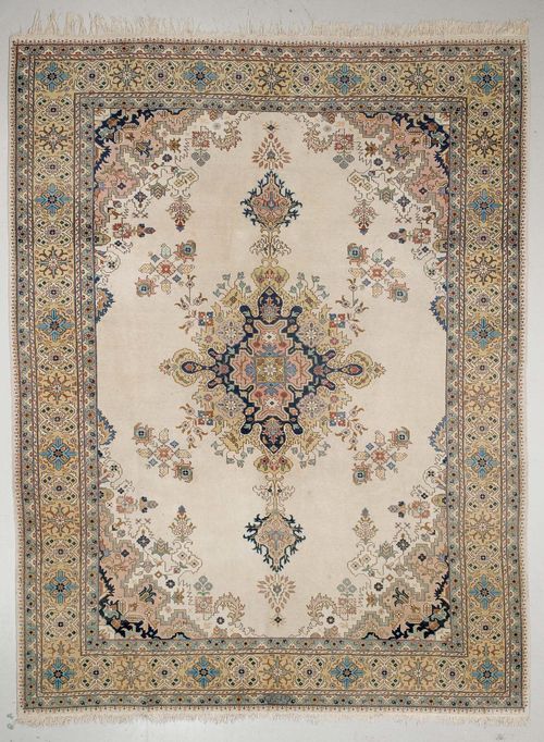 TABRIZ old.Beige ground with a central medallion, pink corner motifs, yellow edging with stylized blossoms, 285x390 cm.