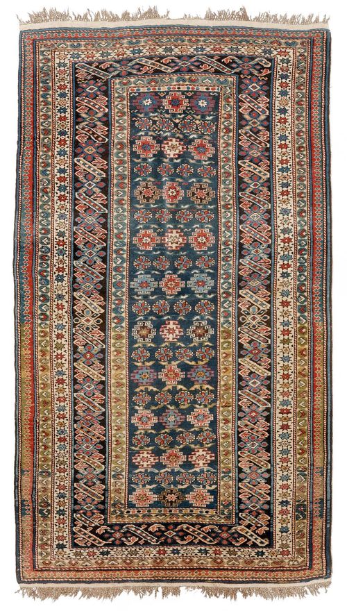 TCHI-TCHI antique.Blue central field geometrically patterned with star motifs, wide edging in blue and white, 116x195 cm.