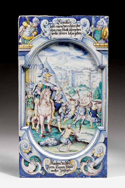 CERAMIC TILE,Winterthur, signed HP for Hans Heinrich III Pfau and dated 1673. Depiction of a historical scene, inscription on the top and lower edge: 'Camillus lässt einem Verrähter der ihm eine Statt übergeben wollte seinen Lohn geben. Knaben müssen Ihren eignen Schulmeister züchtigen'. Signed 'HP Pinxit' and dated 1673. 50 x 28 cm.