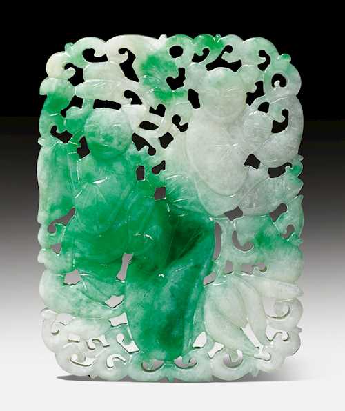 A RETICULATED JADEITE PENDANT.