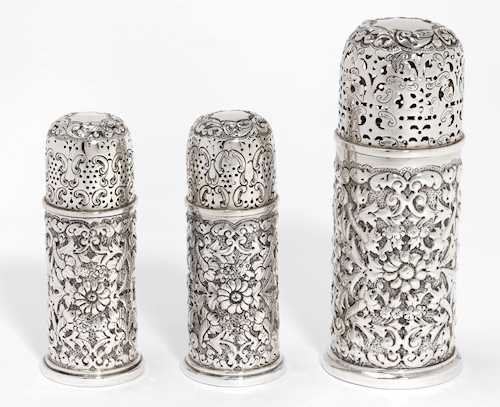 A SET OF THREE SPICE SHAKERS