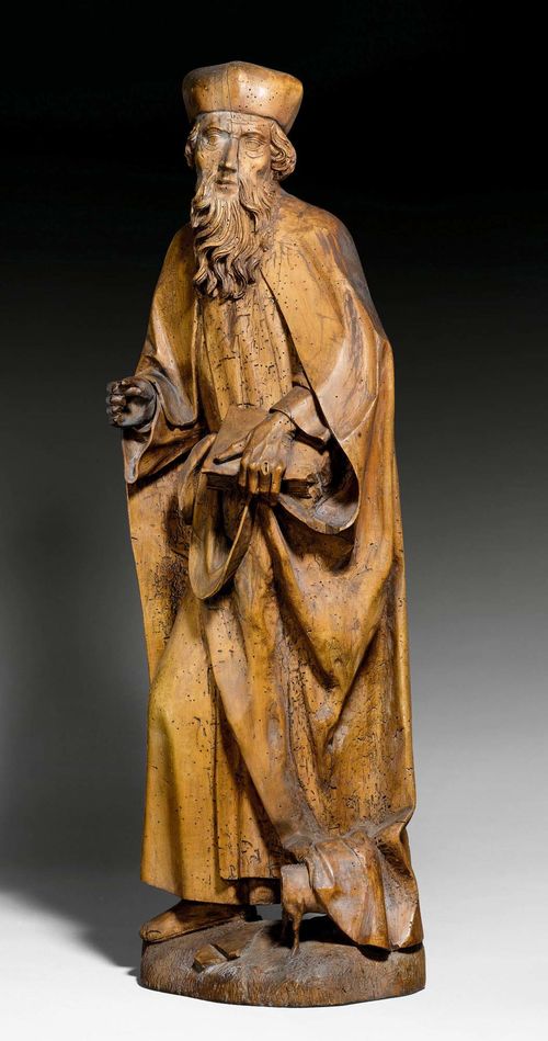 SAINT ANTHONY OF THE DESERT, South German, circa 1490/1500. Carved limewood and verso hollowed. With a small pig (incomplete) at his feet. H 95.5 cm. One fold of his robe replaced.