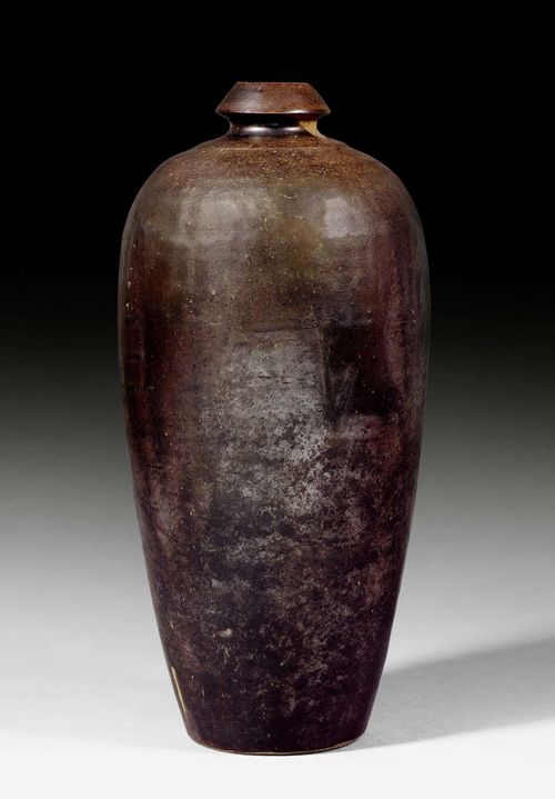 A SLENDER OVOID VASE COVERED WITH BLACK GLAZE. China, Cizhou, Yuan dynasty, height 37.5 cm.