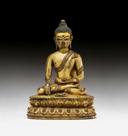 A GILT COPPER ALLOY FIGURE OF BUDDHA SHAKYAMUNI WITH VAJRA. Tibet, 14th/15th c. Height 15 cm.