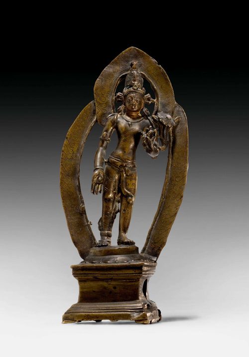 A BRONZE FIGURE OF THE STANDING PADMAPANI WITH AUREOLE. Tibet, Pala style, 12th c. Height 20 cm. Minor damage.