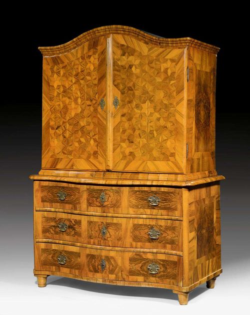 CABINET ON CHEST,Baroque, German, 18th century. Walnut and burlwood in veneer, inlaid with parquetry decoration and reserves. Interior with 3 adjacent drawers. Bronze mounts and drop handles. 137x72x201 cm.
