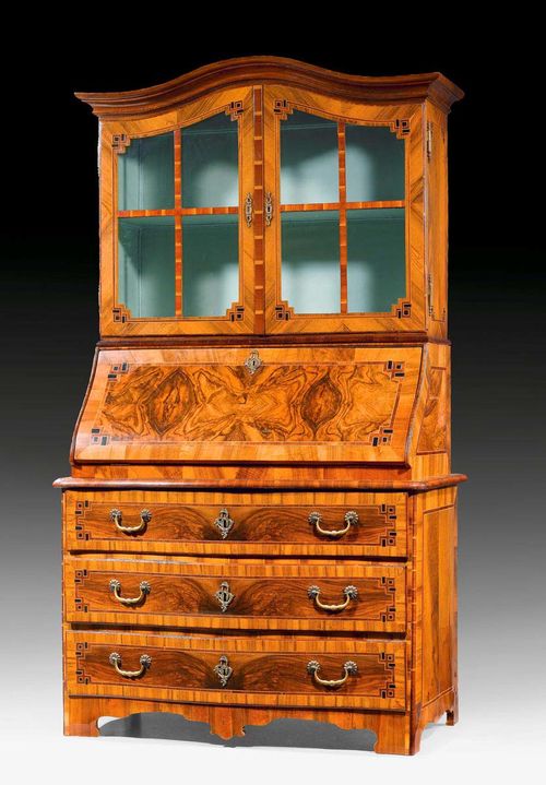 BUREAU CABINET WITH VITRINE,Baroque, Bern, 18th century. Walnut, burlwood, cherry and local fruitwoods in veneer and inlaid with fillets and reserves. Fitted interior of drawers and compartments. Bronze mounts and drop handles. 114x57x(open 99)x198cm.