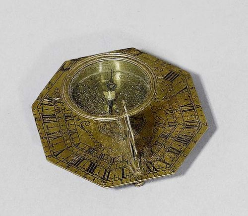 A HORIZONTAL SUNDIAL IN CASE, Paris, circa 1710. Brass sign. N. BION A PARIS, with bird-shaped pointer. In leather covered wooden case, 8x7x1.7 cm.