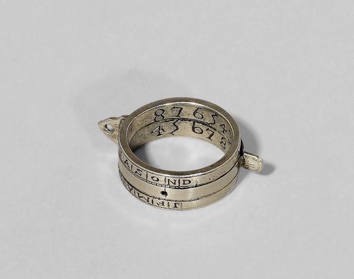 AN ENGRAVED IRON RING DIAL, possibly South German, sign. JO.H.S.THON and dated 1721. D 4.5 cm. The adjustable inner ring possibly later.