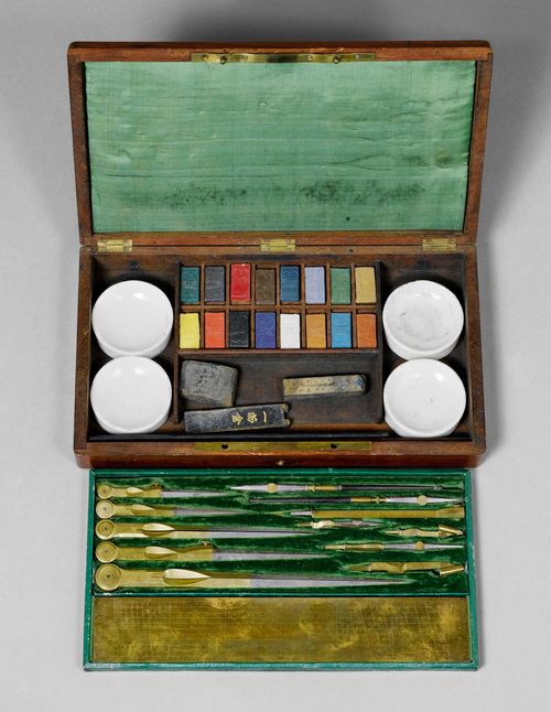 A DRAWING SET WITH WATER-COLOURS, France, 19th c. Containing numerous drawing instruments of steel and brass. With lower compartment with painting utensils. In mahogany case with green silk and velvet lining, 30.5x17.5x4.5 cm.