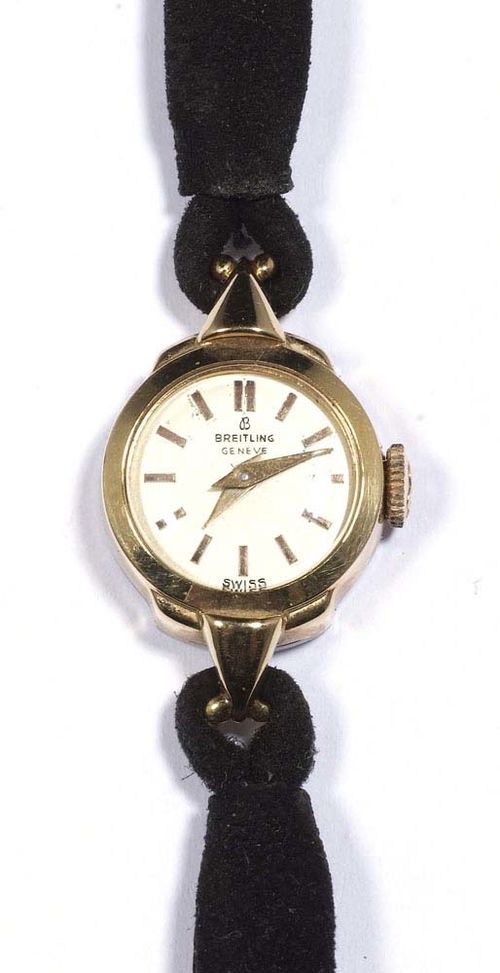 LADY'S WRISTWATCH, BREITLING, ca. 1950. Steel, gold-plated. Small round case No. 5513, signed Breitling, with two triangular attaches. Silver-coloured dial with gold-coloured indices and hands, signed Breitling Genève. Hand winder, movement signed. Fine black velvet band. D 15 mm.