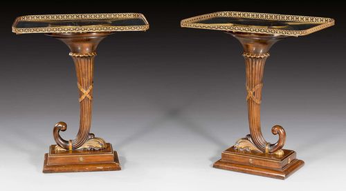 PAIR OF SIDE TABLES "A LA CORNE D'ABONDANCE",Restauration style, Paris circa 1900. Shaped and finely carved mahogany. The glass top edged in pierced brass rail. 61x49.5x72.5 cm.
