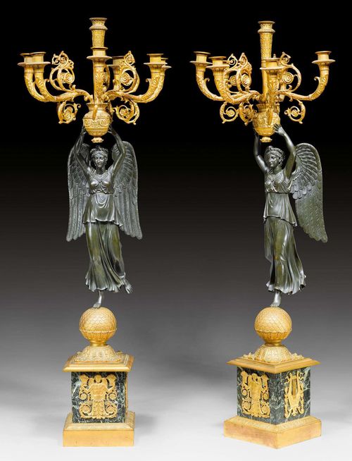 PAIR OF CANDELABRAS "AUX VICTOIRES", Empire style, after models by P.P. THOMIRE (Pierre Philippe Thomire, 1751-1843), Paris. Matt and polished gilt bronze, burnished bronze, and "Vert de Mer" marble. Rich bronze mounts and applications. H 109 cm.