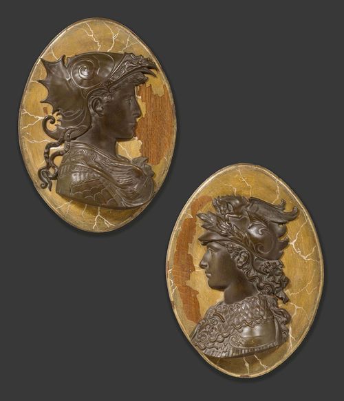 PAIR OF PORTRAIT MEDALLIONS,Empire style, probably Northern Italy, 19th century. Burnished bronze and painted wood. Profile portrait reliefs of two mythological persons, probably Mars and Miverva, on an oval, "en faux marbre" painted plaque. Painting with some losses. H 58 cm.