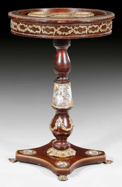 ROUND GUERIDON WITH PLAQUES,Napoleon III, Paris circa 1870. Mahogany and colorful plaques made of ceramic and metal. Bronze mounts. D 50 cm, H 73 cm. Provenance: Aristocratic collection, Germany.