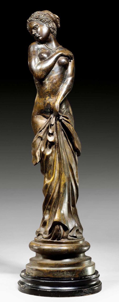 BRONZE FIGURE OF A WOMAN,France circa 1900. On a chipped, black wooden base. H 81 cm. Provenance: Aristocratic collection, Germany.