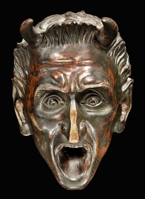 BRONZE DEVIL MASK,Revival style, probably German, late 19th century. Burnished bronze. 15x21 cm.