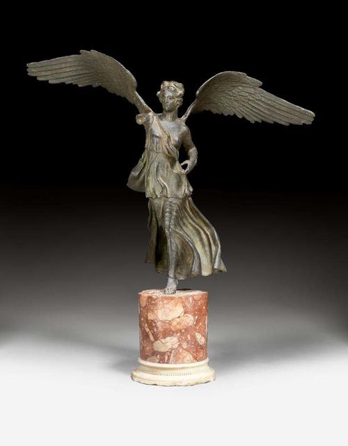 FIGURE OF VICTORIA,according to ancient designs, probably Rome, 19th century. Cast iron with red and white marble. Some chips. 1 arm missing. H 61 cm.