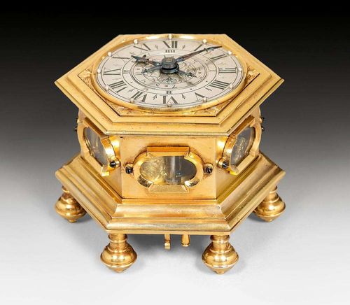 TABLE CLOCK,Baroque, the movement signed and numbered GRAUPNER AUGSPURG 151 (Paul Gottfried Graupner, circa 1680-1756), Augsburg circa 1740. Gilt bronze and finely engraved silver. Verge escapement with balance-wheel, 2 rack striking mechanisms and 4/4 striking on 2 bells on demand. Alarm clock.  10x8.5x8 cm.