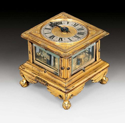 TABLE CLOCK,Baroque, the movement signed JACOB PINSAUER CIBURG, German, 17th century. Engraved bronze and silver. Finely gilt verge escapement with balance-wheel and locking plate striker, striking the hours on bell. Gilt plate. 7.5x7.5x7.5 cm.