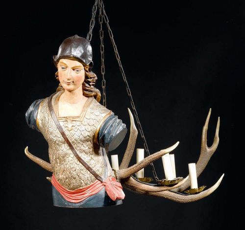 CHANDELIER WITH MALE FIGURE,Baroque, German, 18th century. Carved and polychrome painted wood. Saint Gregory with antlers as light holders. With chain. Fitted for electricity. L 100 cm, H 60 cm.