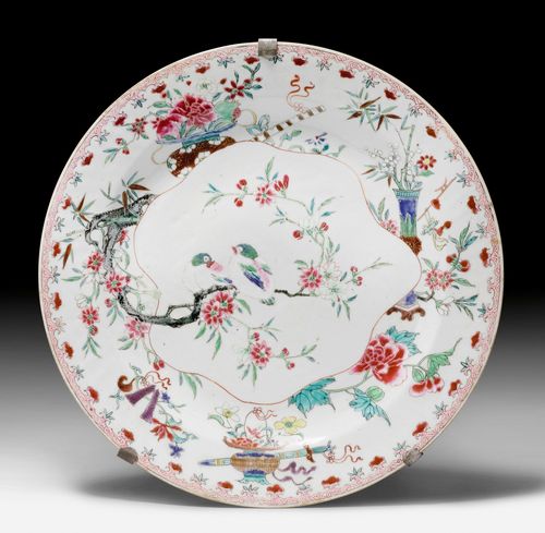 A LARGE ROUND DISH DECORATED IN FAMILLE ROSE COLOURS AND GOLD WITH BIRDS ON A BLOSSOMING PLUM TREE BRANCH AND BUDDHIST EMBLEMS WITH FLOWERS. China, 18th c. Diameter 35.5 cm.