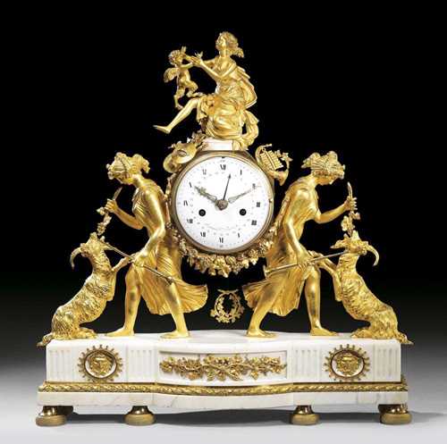 MANTEL CLOCK "AUX BACCHANTES", Louis XVI, von P.P. THOMIRE (Pierre-Philippe Thomire, 1751-1843), the dial signed  ARMINGAUD L'AINE A PARIS, Paris circa 1785. Matte and polished gilt bronze and "Carrara" marble. Hexagonal case held aloft by 2 bacchantes and a ram, a seated bacchante with satyr. The clock with enamel dial, fine verge escapement striking the 1/2 hours on bell. 50x16x52 cm.