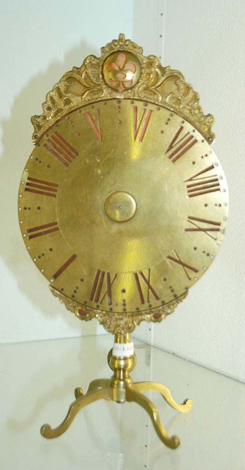 NACHTUHR, Louis XV, Bern circa 1750/70. Bronze and brass. With pierced  turning brass disk before bronze case. Verge escapement with short back  pendulum. 16x10x31 cm. Provenance: Swiss private collection.