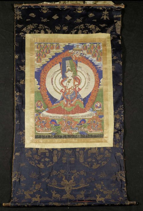 A THANKA OF USHNISHASITATAPATRA, A FORM OF THE WHITE TARA. Tibet, 18th c.65x44 cm. Brocade mounting.