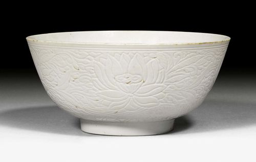 A WHITE BOWL ENGRAVED WITH LOTUS PATTERN. China, Jiajing mark but Kangxi period, diameter 19.2 cm.