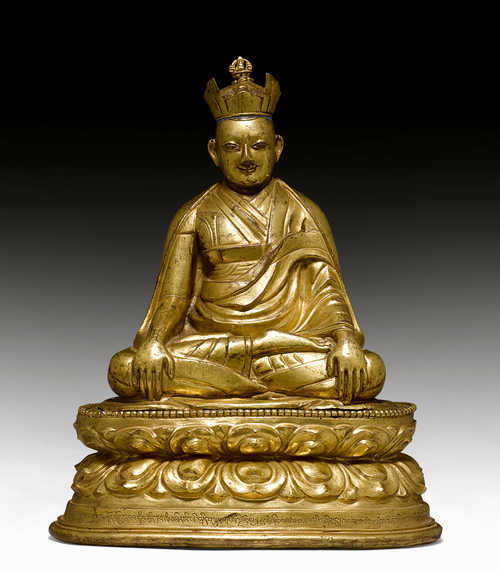 A GILT COPPER REPOUSSE FIGURE OF A KARMAPA.