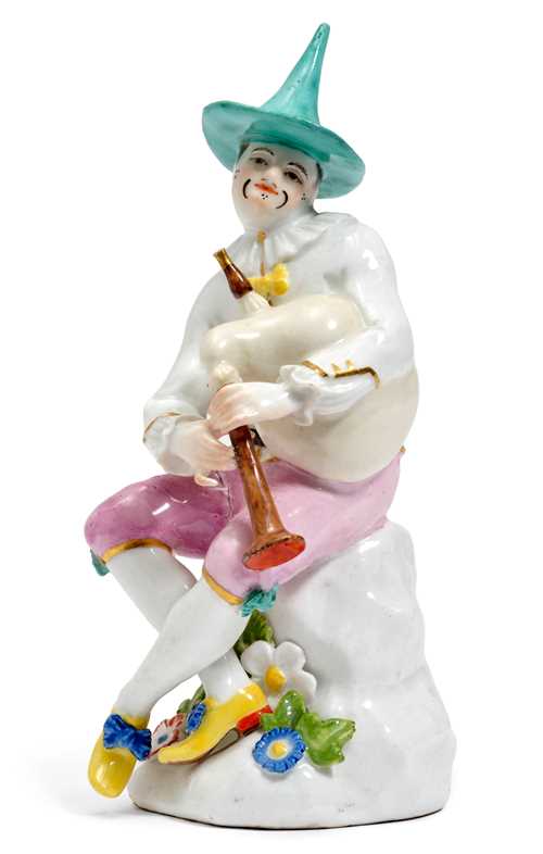 FIGURE OF A HARLEQUIN WITH BAGPIPES