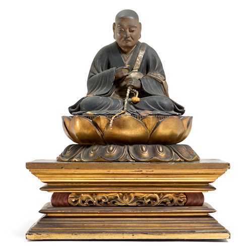 A WOOD FIGURE OF A MONK.
