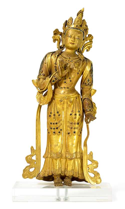 A GILT COPPER REPOUSSE FIGURE OF THE STANDING MAITREYA.
