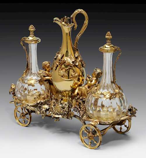 A VICTORIAN SILVER-GILT DECANTER TROLLEY