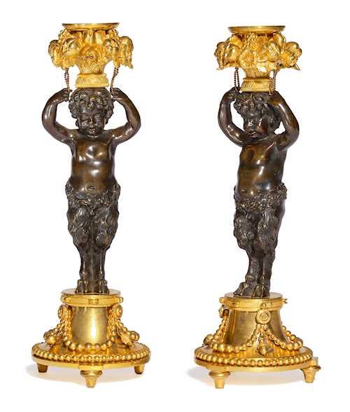 A PAIR OF CANDLESTICKS, WITH A YOUNG SATYR