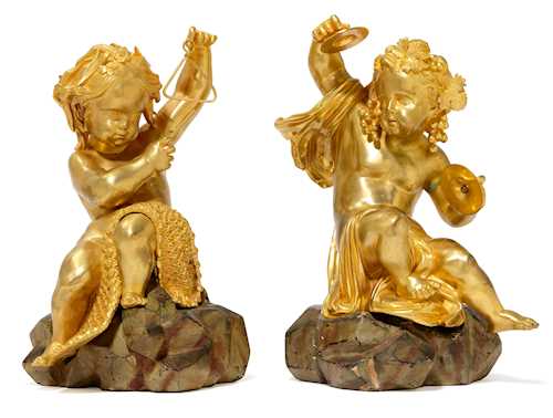 A PAIR OF PUTTI MAKING MUSIC