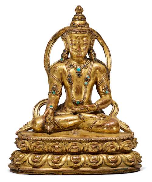 A GILT COPPER ALLOY FIGURE OF TATHAGATA RATNASAMBHAVA.