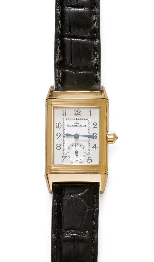 DIAMOND WRISTWATCH, JAEGER LE COULTRE, REVERSO DUETTO. Pink gold 750. Ref. 256.2.75. Gold case No. 2218860 with unidirectionally rotatable lunette. Black dial with white Arabic numerals and hands. The back with a silver-coloured dial with black numerals, blued hands, small second at 6h. Hand winder, Cal. 865. Black dial with Jaeger fold-over clasp. D 23 x 29 mm. With case and copy of revision, July 2013.