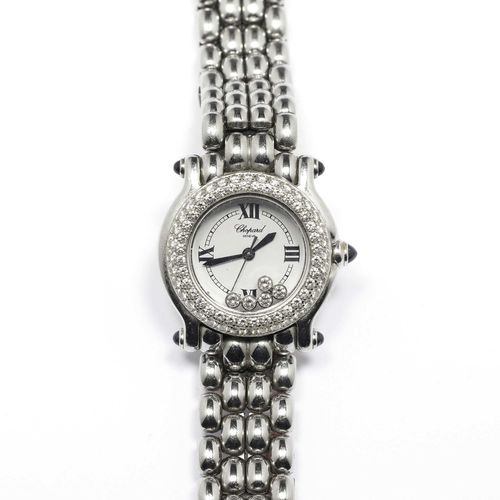 LADY`S WRISTWACH WITH DIAMOND, CHOPARD, HAPPY SPORT. Steel. Ref. 27/8294-23. Round case nr. 456453 8246 with diamond-bezel of ca. 1.40 ct. Crown and lugs decorated with 5 sapphire. Dial with 4 roman numerals, blued steel hands, center second, 7 diamonds ca. 0.39 ct. Quartz movement. Original band with "grain de riz"-pattern and folding clasp, shorted.