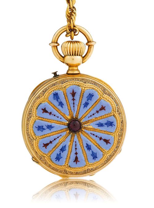 GOLD AND ENAMEL PENDANT WATCH, ca. 1870. Yellow gold 750. Round Lepine case No. 15211, pusher for setting the hands at 1h, the back engraved and enamelled with 12 blue and red segments, the centre set with a tourmaline. Gold dust cover with dedication: Frieda Meister Souvenir de A. Fellmann 1871. White, enamelled dial with black Roman numerals and blued hands. Cylinder movement with crown winder and blued screws, wolf's tooth winding. D 30 mm. With braided chain in gold, L 70 cm.