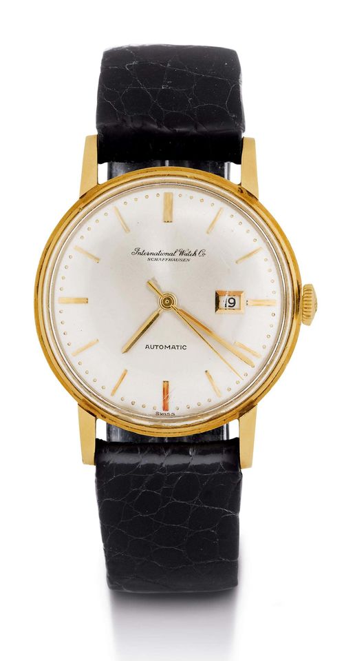 IWC CLASSIC AUTOMATIC GENTLEMAN'S WRISTWATCH, 1960s. Yellow gold 750. Round, polished case No. 1644327, pressed back with dedication, Plexiglas (edge missing). Silver-plated dial with applied gold indices and gold hands, central second, date at 3h. IWC Automatic Cal. 8531, movement No. 1678367 Pellaton system, screw balance with Breguet spring and swan neck regulator. Black leather band with gold-plated clasp. D 34 mm.