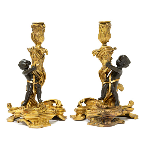 Pair of bronze candelabra with putti